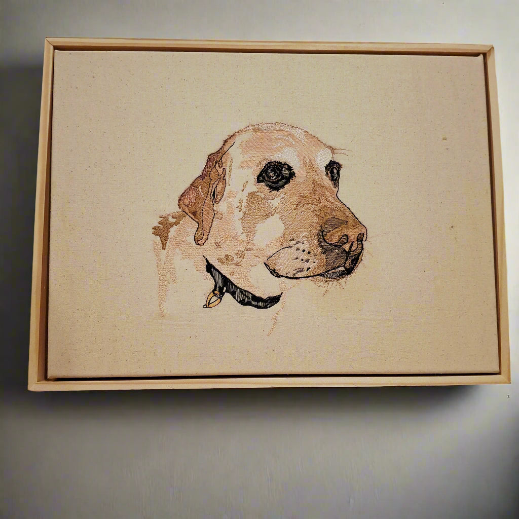 Framed artwork of a dog's head on a plain background